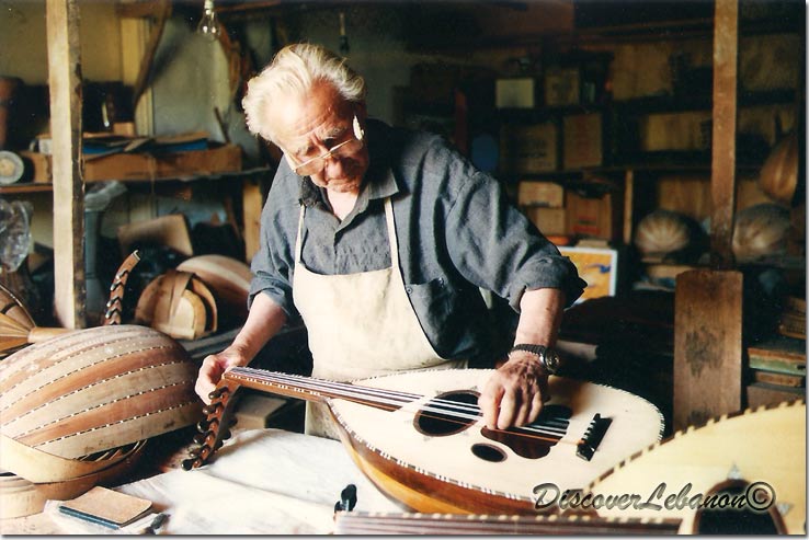 Old man preparing a lute