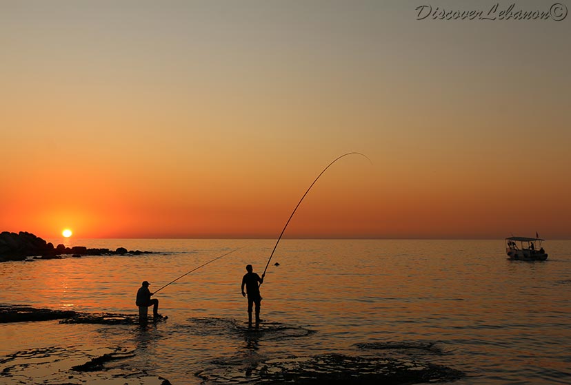 Fishermen at sunset time