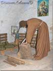 Priest working wood