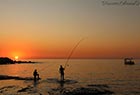 Fishermen at sunset time