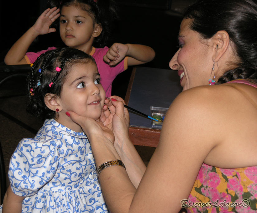 Yuna coloring her face and happy...