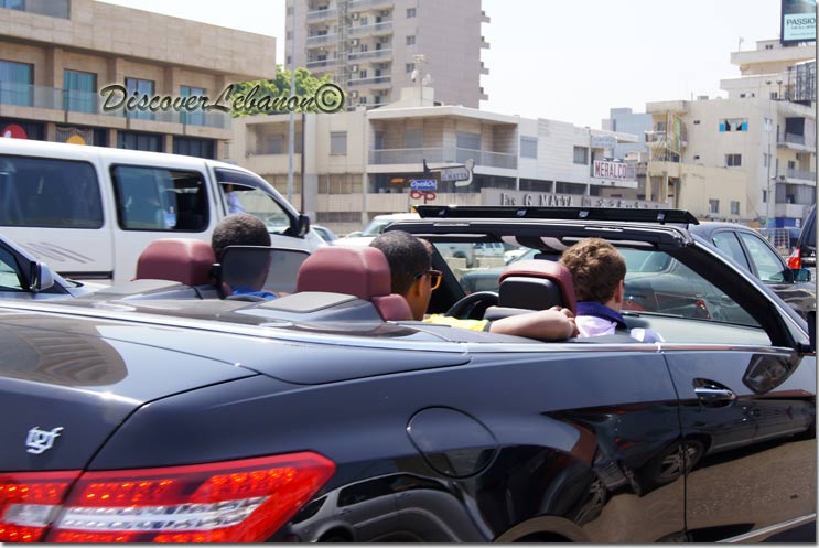 Guys in a convertible car